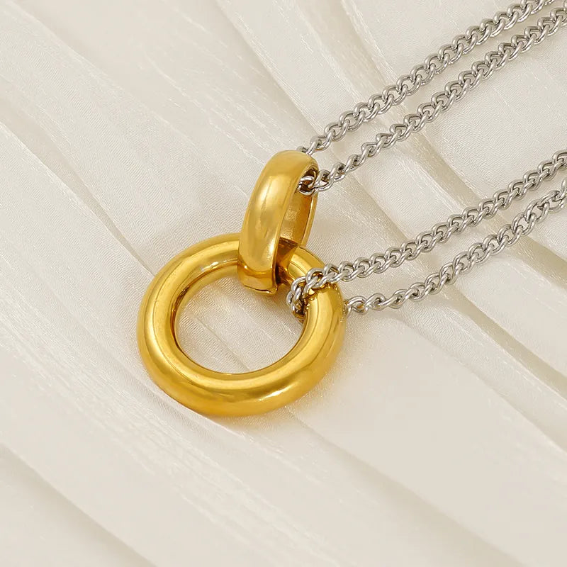 Collar cadena delgada doble con dije doble círculo.