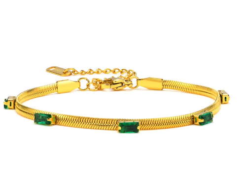Pulsera plana con circonias verdes. Color dorado.
